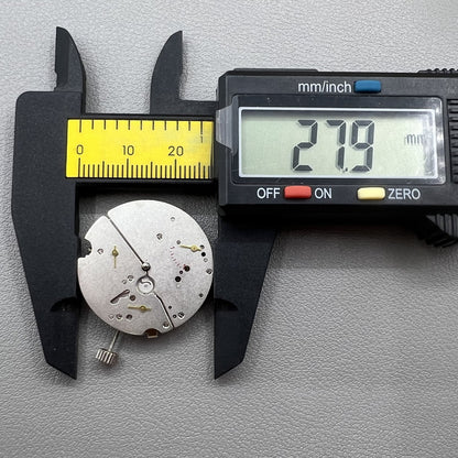 Tianjin ST17 T17 hand-wound watch movement with two hands and power reserve indicator at 10 o'clock.