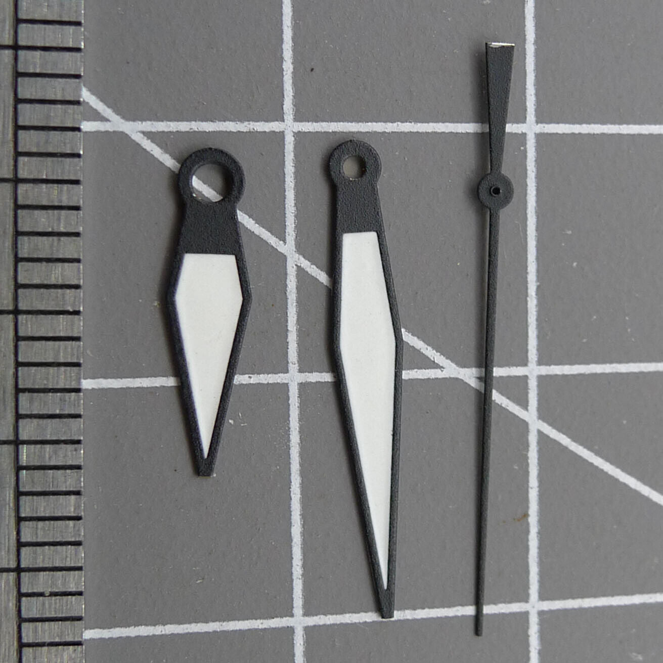 White diamond-shaped orange lume watch hands designed for ETA2836/2846/2824/2846 movements by White+diamond.