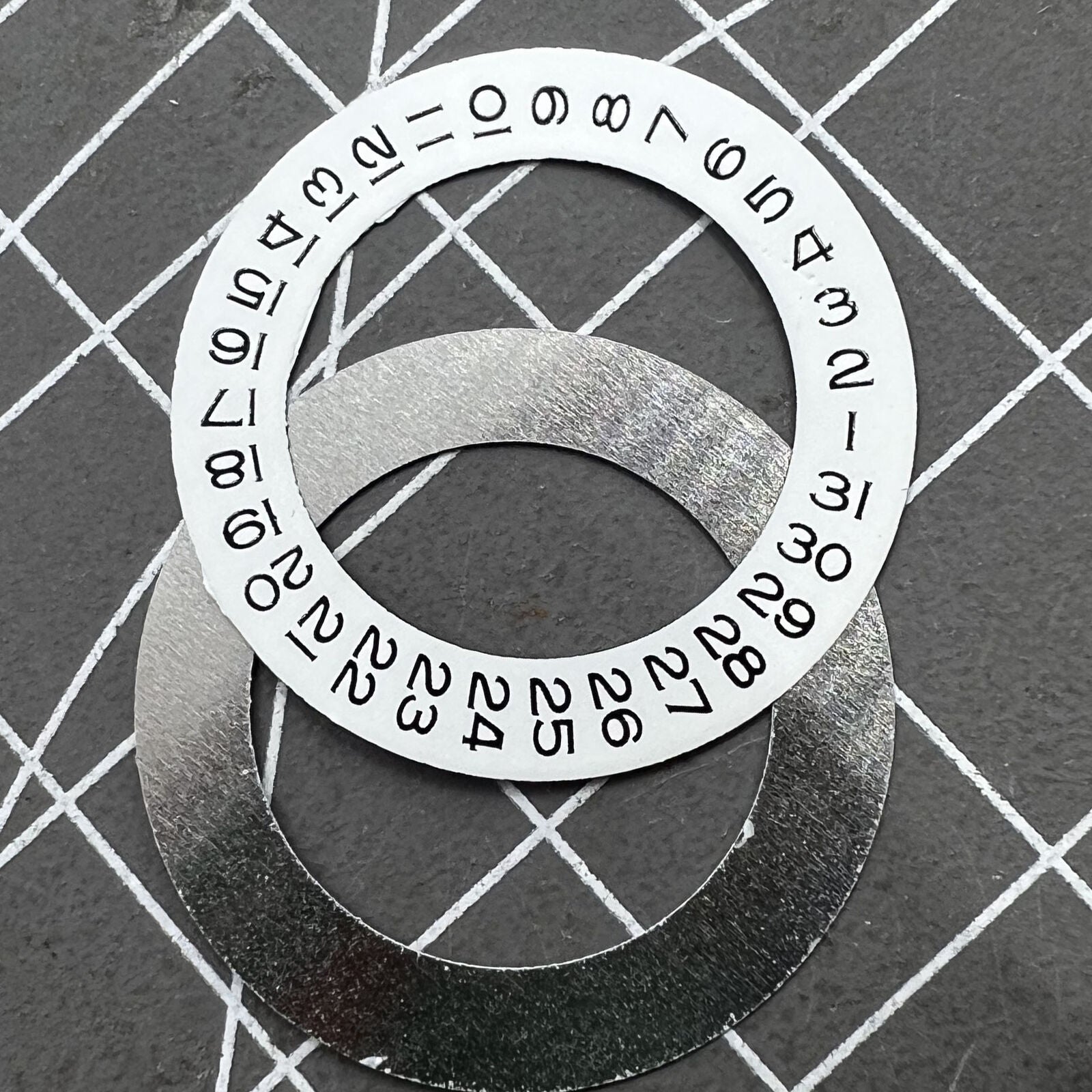 Date disk wheel overlay for Tianjin Seagull 2824 watch movement, precise fit and durable design.