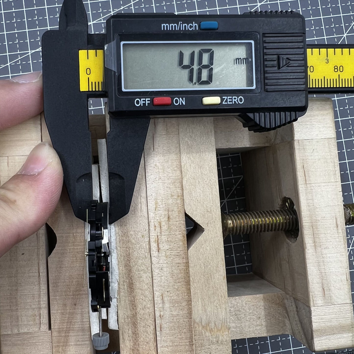 Swiss ETA G10.212 quartz watch movement displaying hour, minute, second hands with date in precision timing mechanism.