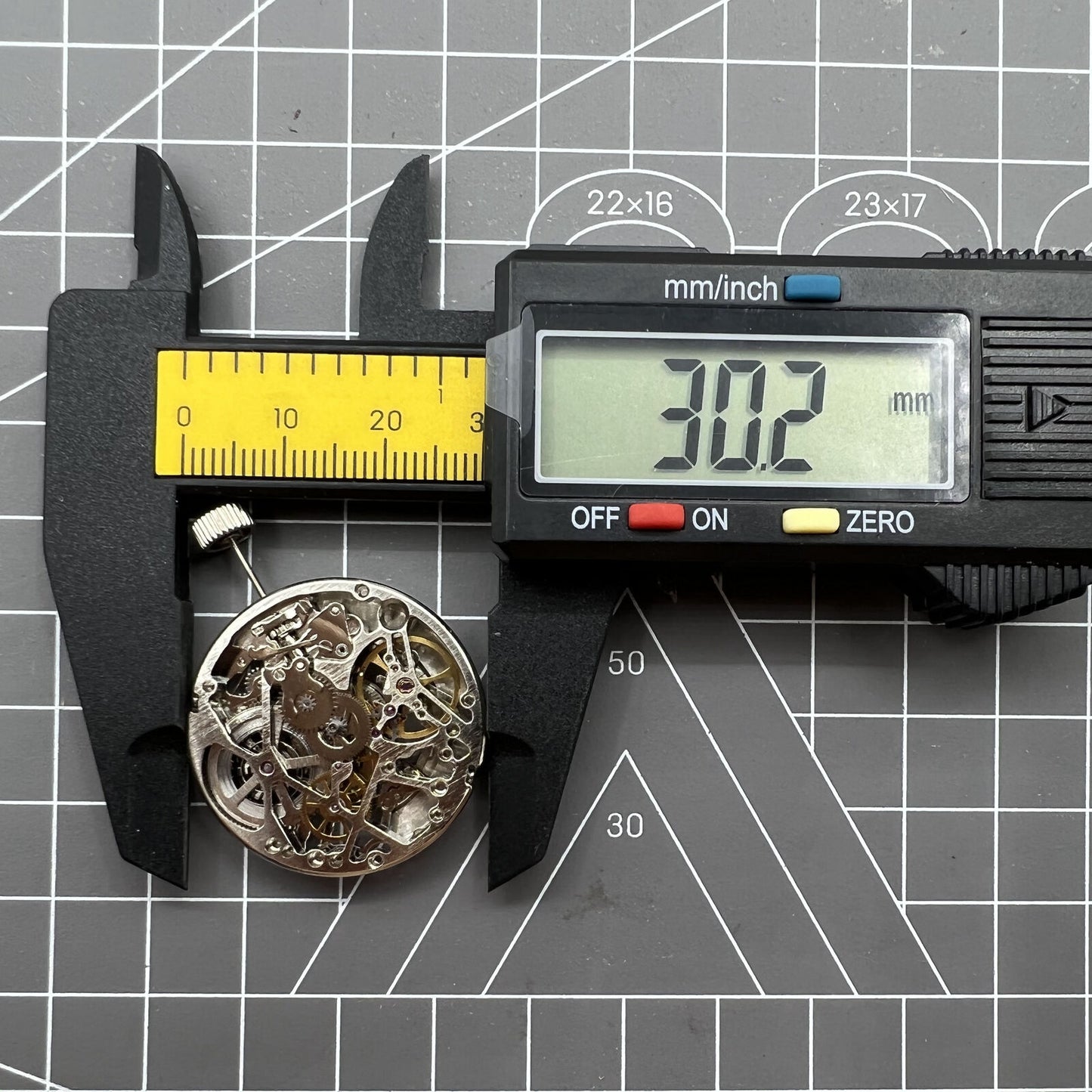 Tianjin Seagull ST25 automatic silver watch movement with hollow design and 3 hands for precise timekeeping.