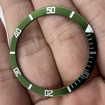 Green aluminum bezel insert for 39mm/32mm watches, enhancing style and durability.
