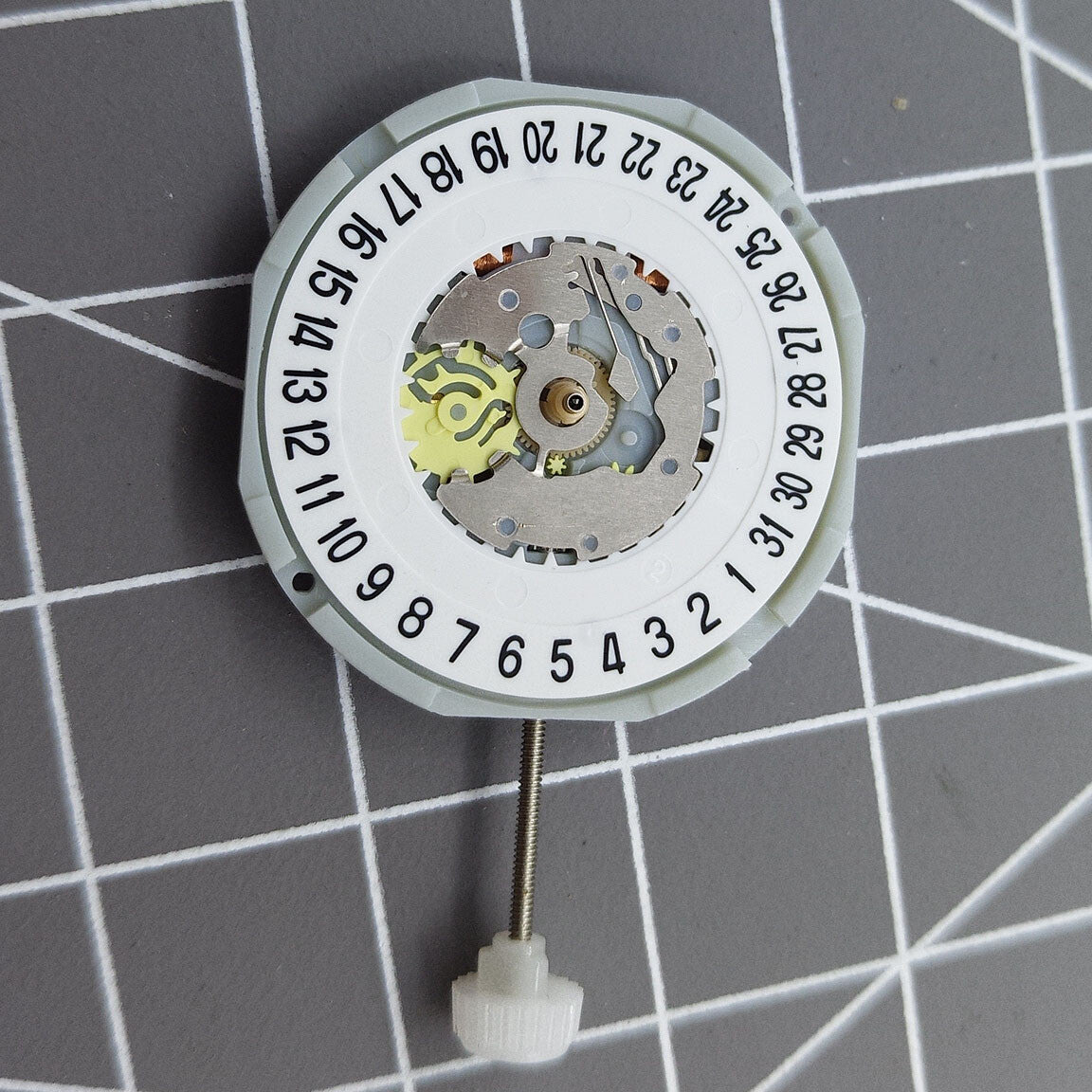 Sunon PE28 quartz watch movement with 3 hands and date display at 6 o'clock position