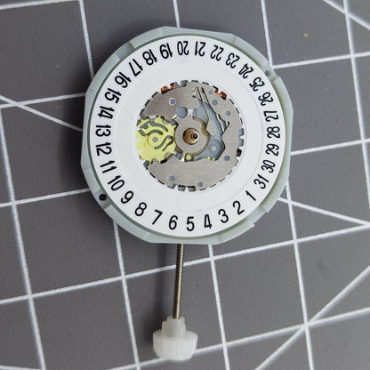 Sunon PE28 quartz watch movement with 3 hands and date display at 6 o'clock position