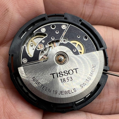 Tissot ETA C15.111 chronograph mechanical watch movement with white dial, Swiss precision craftsmanship.