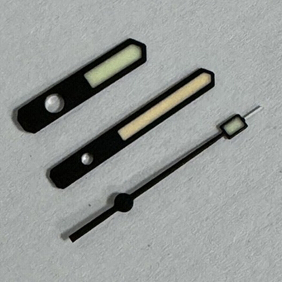 Black matte trim watch hands with green and orange lume, compatible with SKX007/SPR777 NH35A/NH36 models.