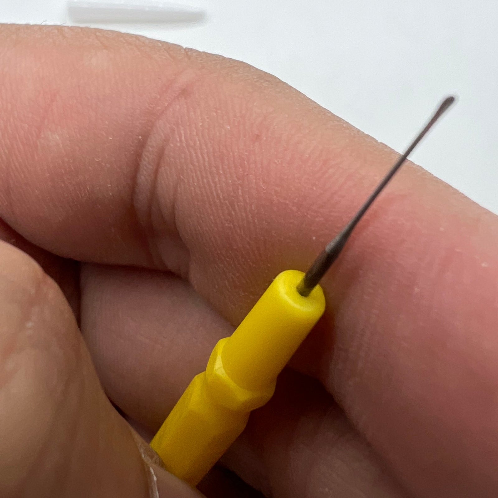 Bergeon 30102-D yellow watch dip oiler for precise Swiss watch repair and maintenance tasks.