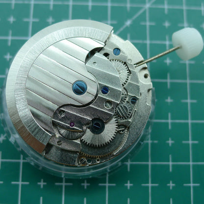 Wholesale Man Shanghai watch accessory featuring automatic mechanical movement with hollow balance wheel at 6 o'clock, highlighting precision craftsmanship.