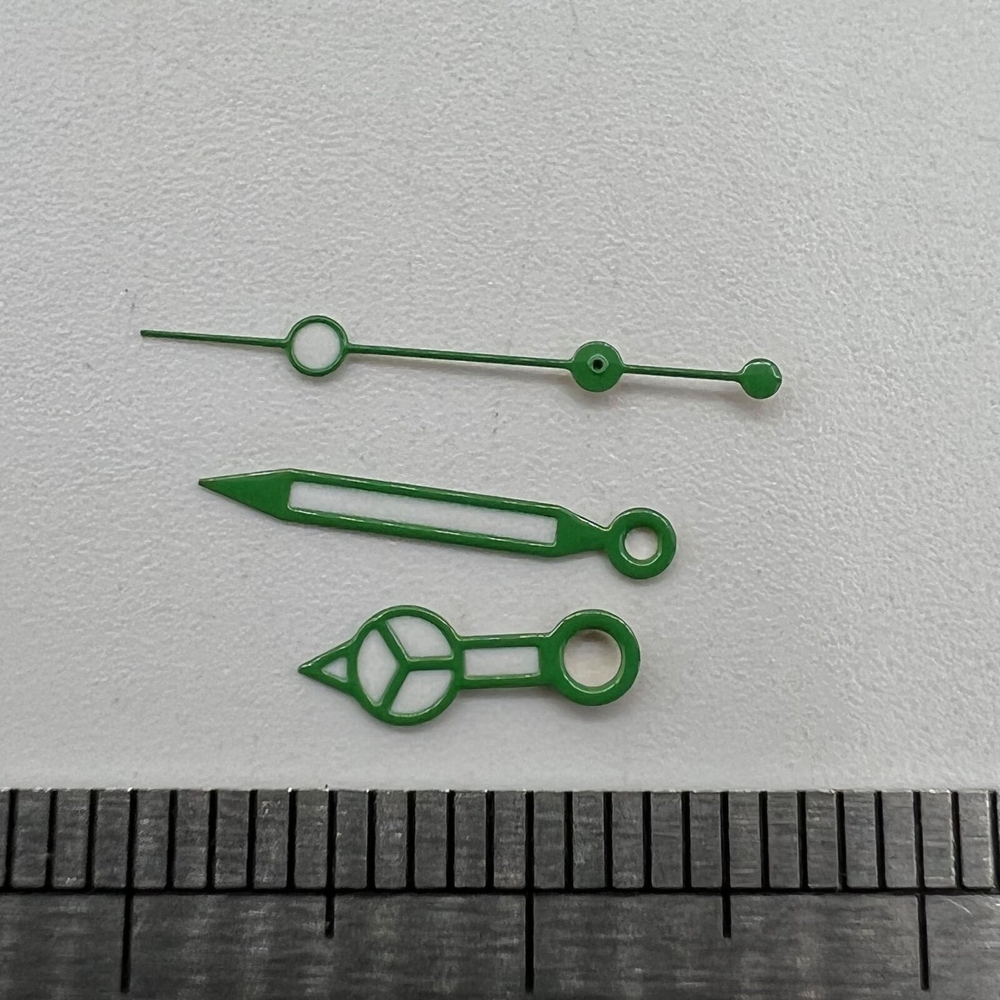 Green luminous watch hands set for NH35 NH36 movement, improving dial visibility and style.