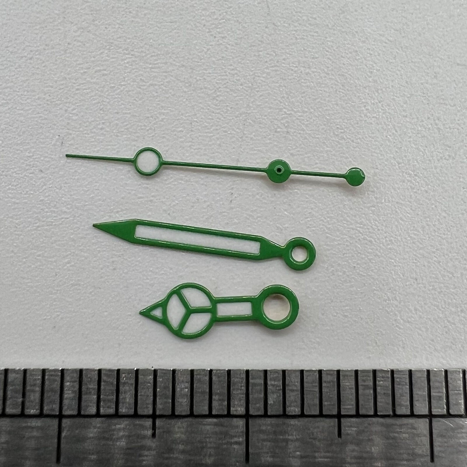 Green luminous watch hands set for NH35 NH36 movement, improving dial visibility and style.