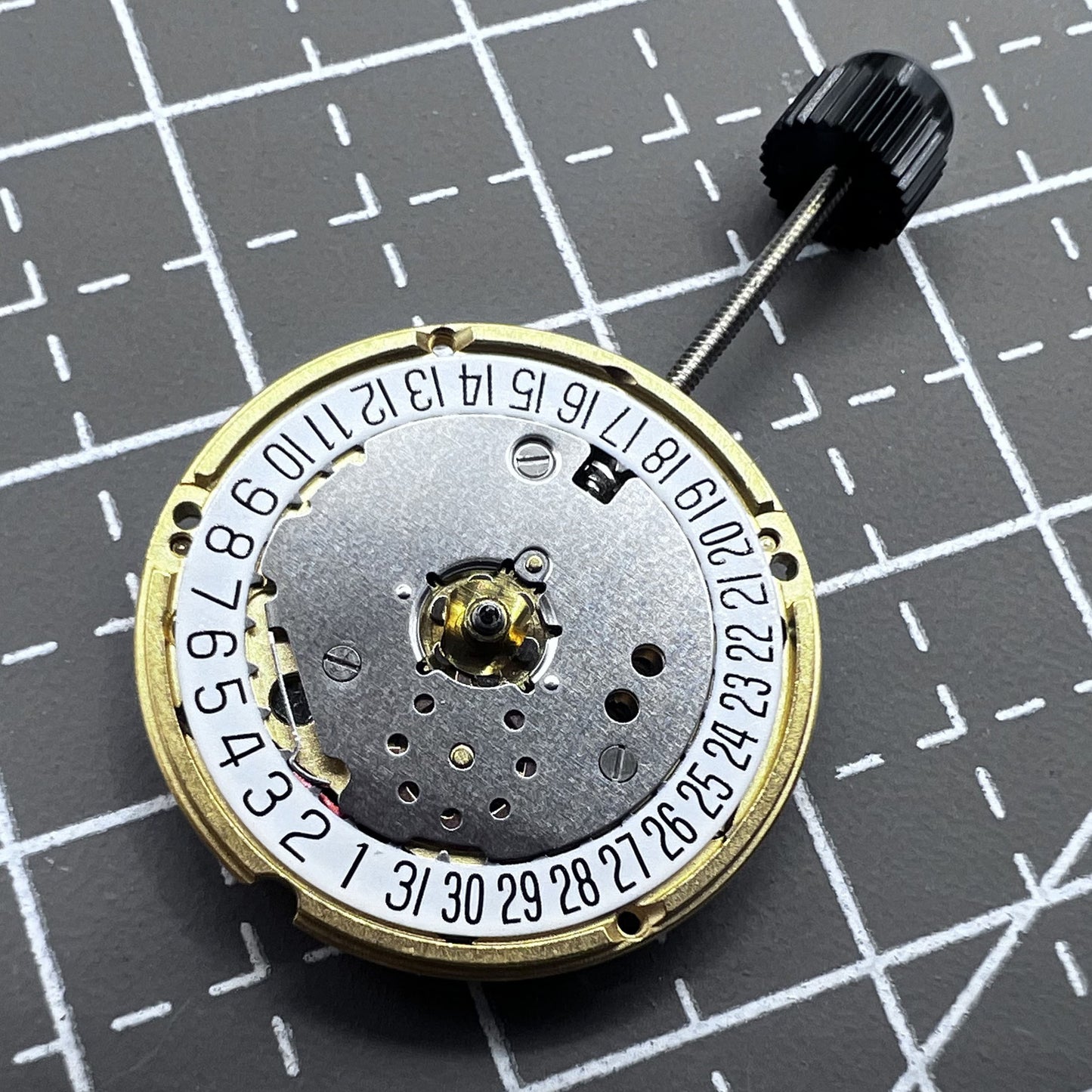 Swiss ETA F03.111 quartz watch movement with 3 hands and date at 6 o'clock, precision timekeeping.