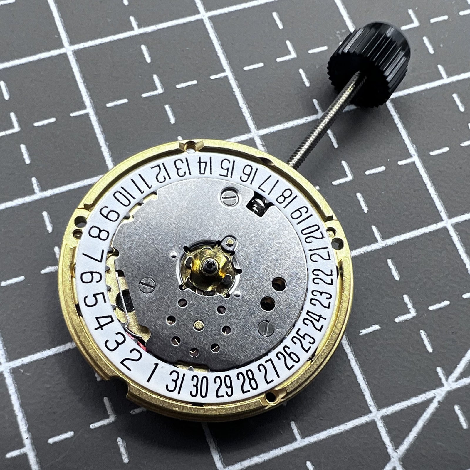 Swiss ETA F03.111 quartz watch movement with 3 hands and date at 6 o'clock, precision timekeeping.