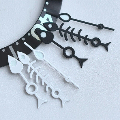Matted black fish bone watch hands with white trim and green lume, compatible with NH35 NH36 movements.