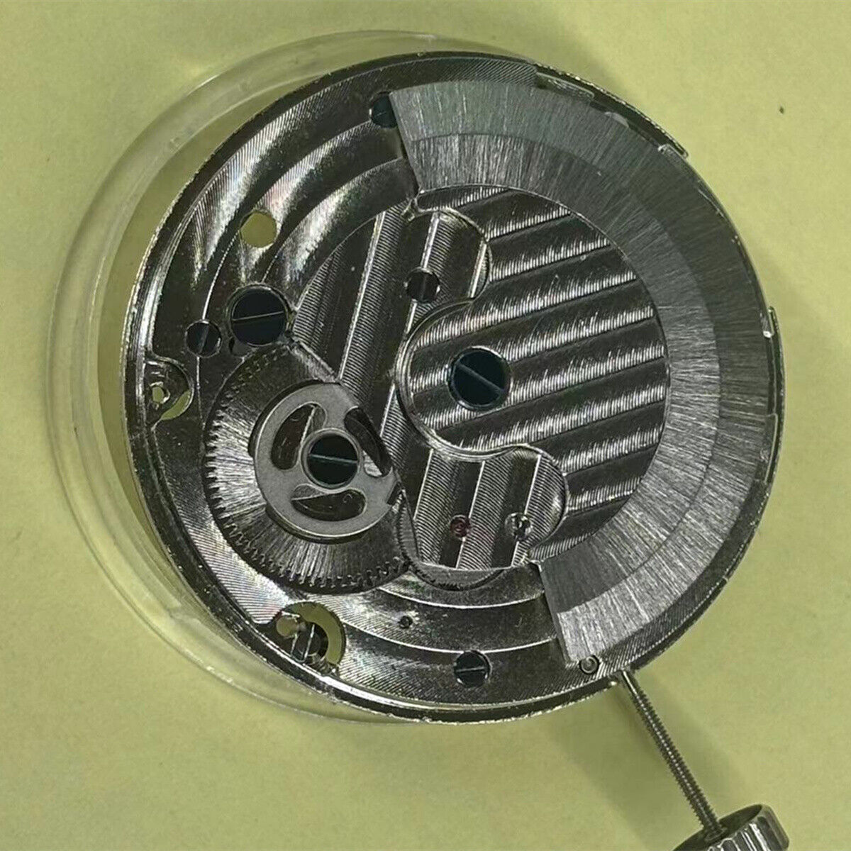 Hollow automatic mechanical watch part featuring moon phase at 12 o'clock, Chinese precision movement.