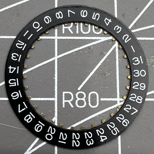 Black date wheel disk for ETA2824 watch movement with date display at 3 o'clock position.