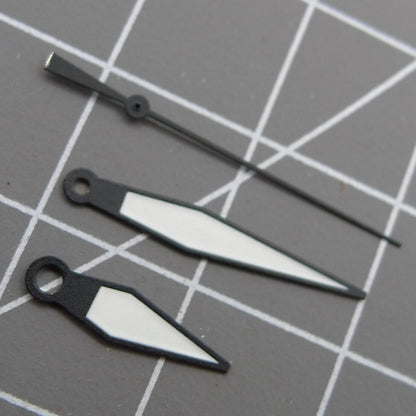 White diamond-shaped orange lume watch hands designed for ETA2836/2846/2824/2846 movements by White+diamond.