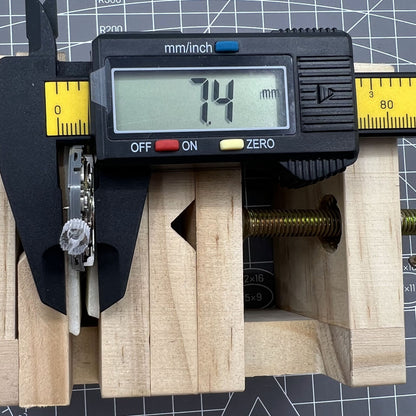 Miyota NH36A automatic watch movement with black finish, blue lume, and crown at 3/3.8 position for accuracy.