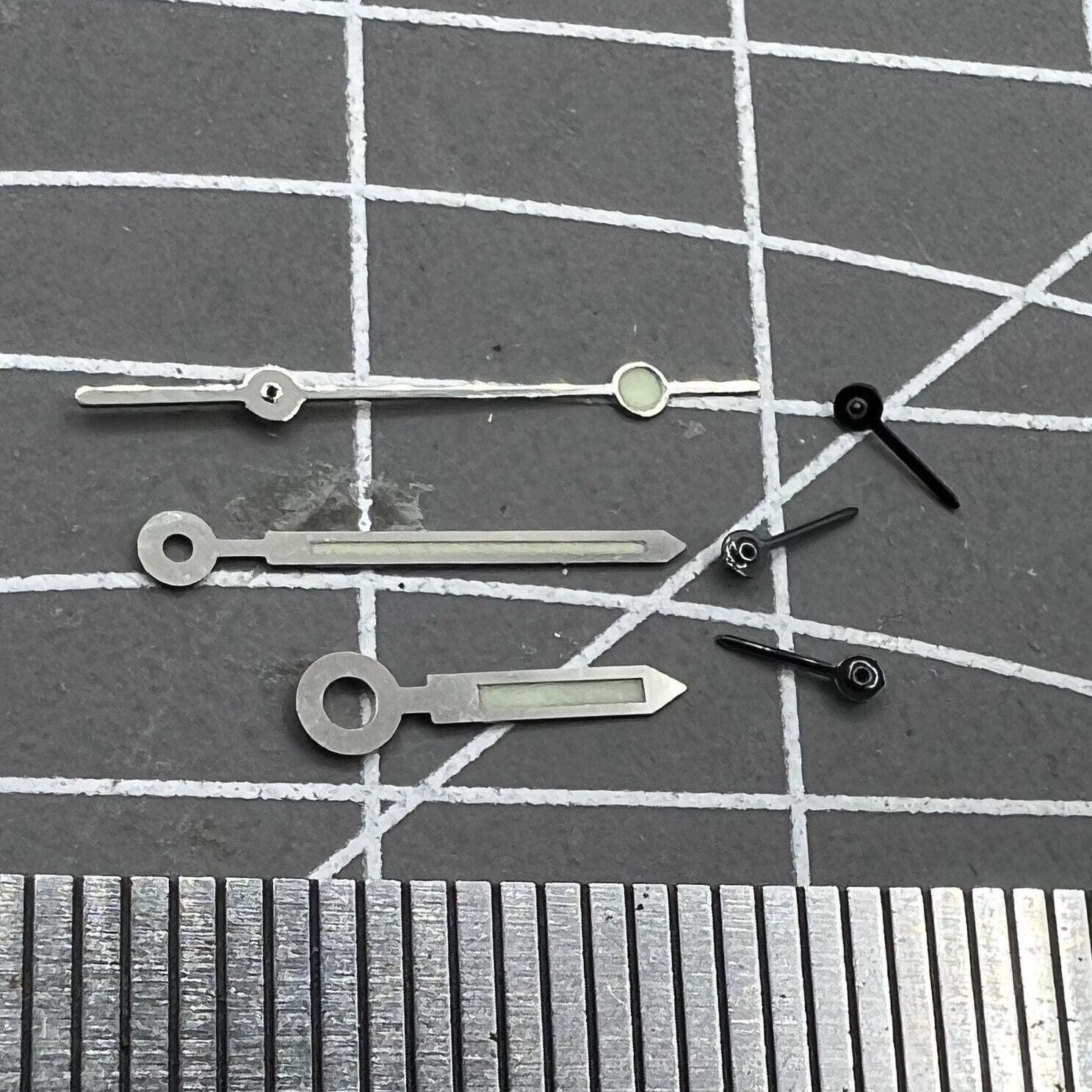 Silver-trimmed green lume watch hands for Miyota OS10 movement, precise and luminous accessory