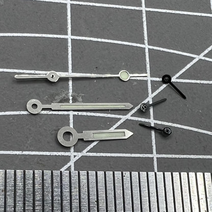 Silver-trimmed green lume watch hands for Miyota OS10 movement, precise and luminous accessory