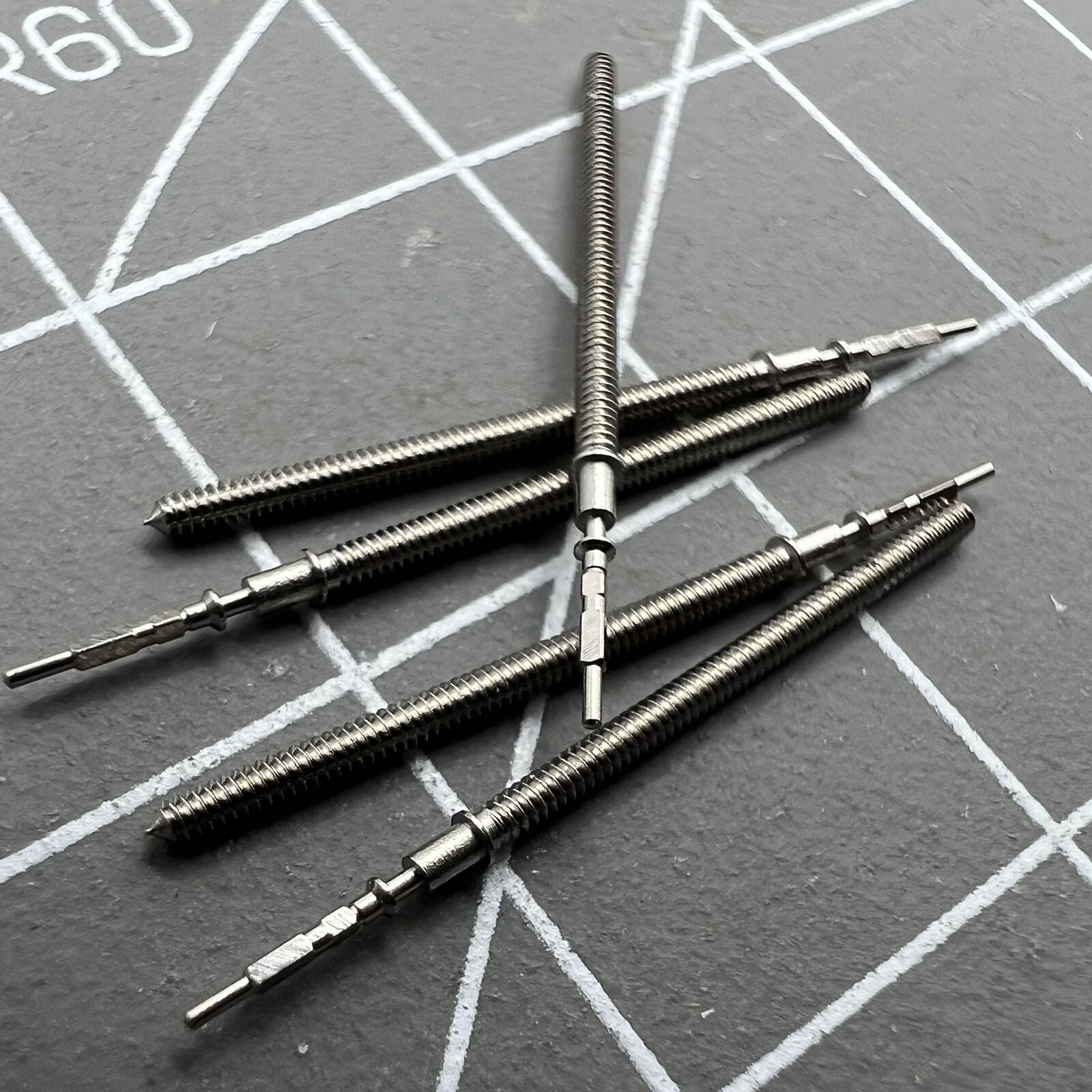 Set of 5 watch winding stems compatible with Hattori Epson TMI VK63/VK64/VK67/VK68 movements for precise repairs.