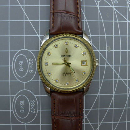 Dandong Peacock 37mm manual mechanical watch with golden dial and single calendar, 33 jewels, elegant style.