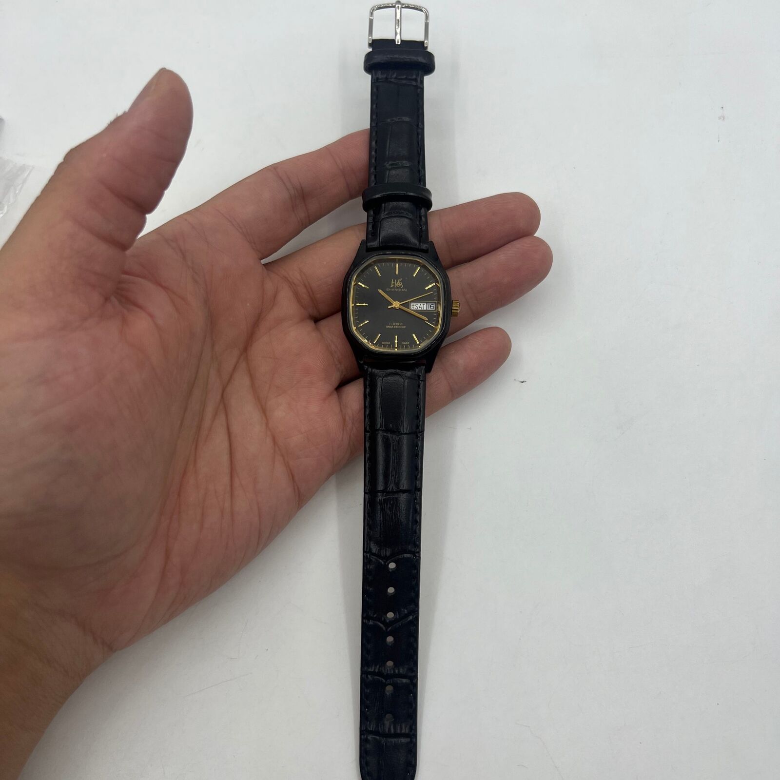 33mm Shanghai Factory manual mechanical watch with black dial and double calendar display.