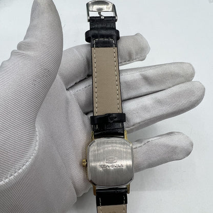 Seagull 28mm ladies watch, golden square case, manual mechanical movement, elegant gold nail markers.