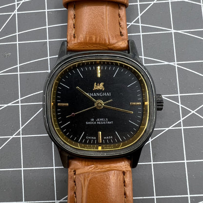 34mm Shanghai Factory manual mechanical watch with black dial, 19 jewels, shock-resistant for daily wear.