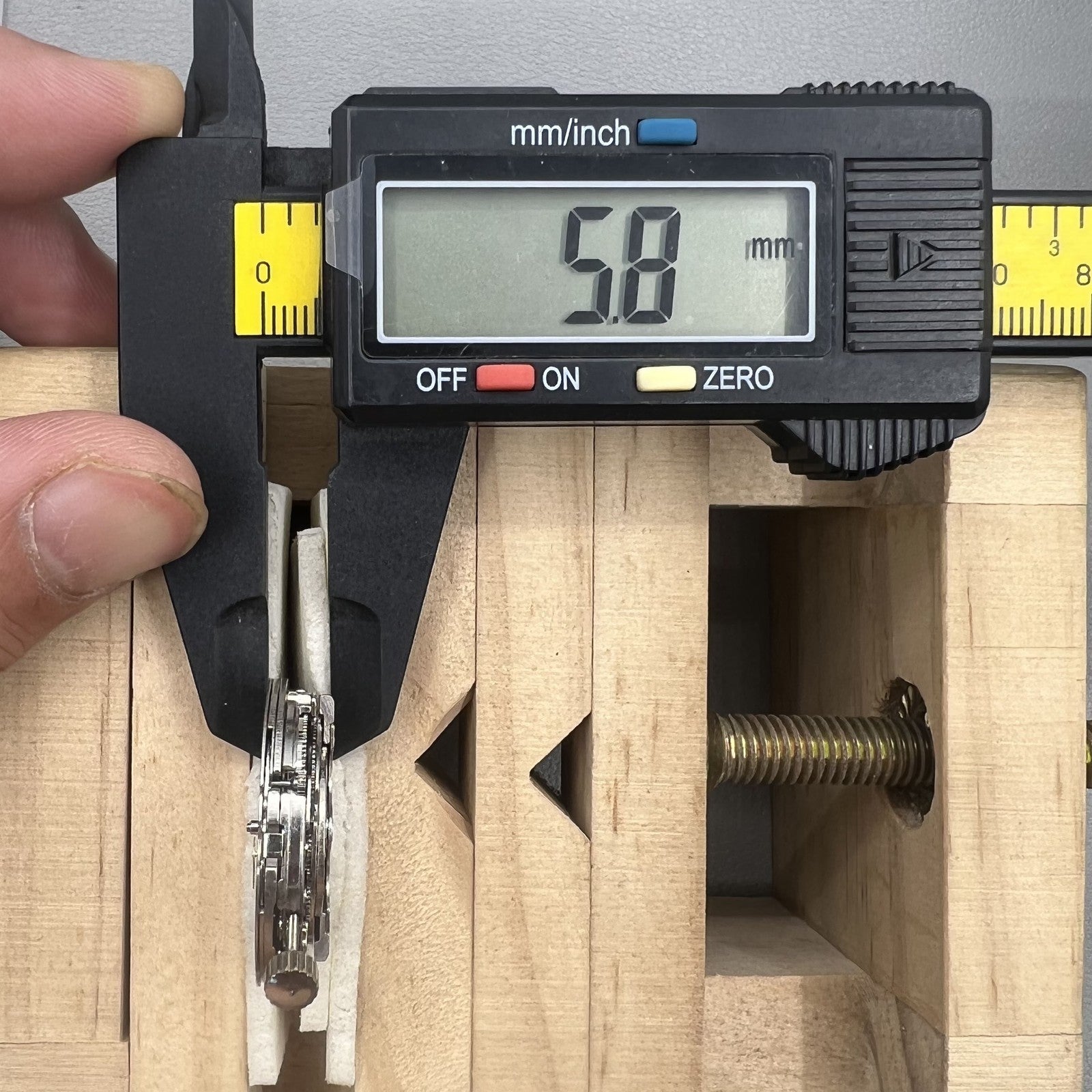 Tianjin ST17 T17 hand-wound watch movement with two hands and power reserve indicator at 10 o'clock.