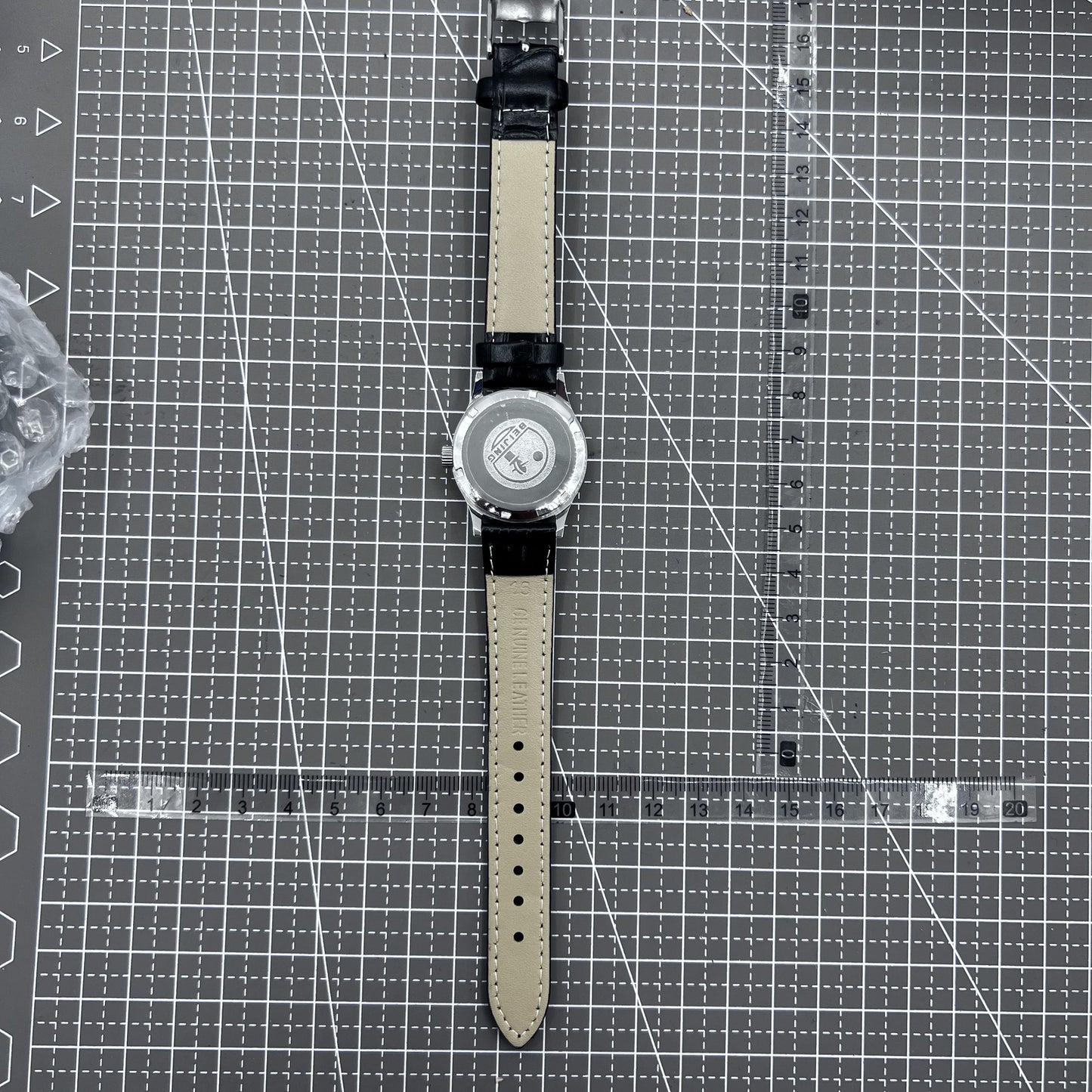 Beijing 31mm mechanical watch with black double rhomb strap, silver case, and classic three-hand design.