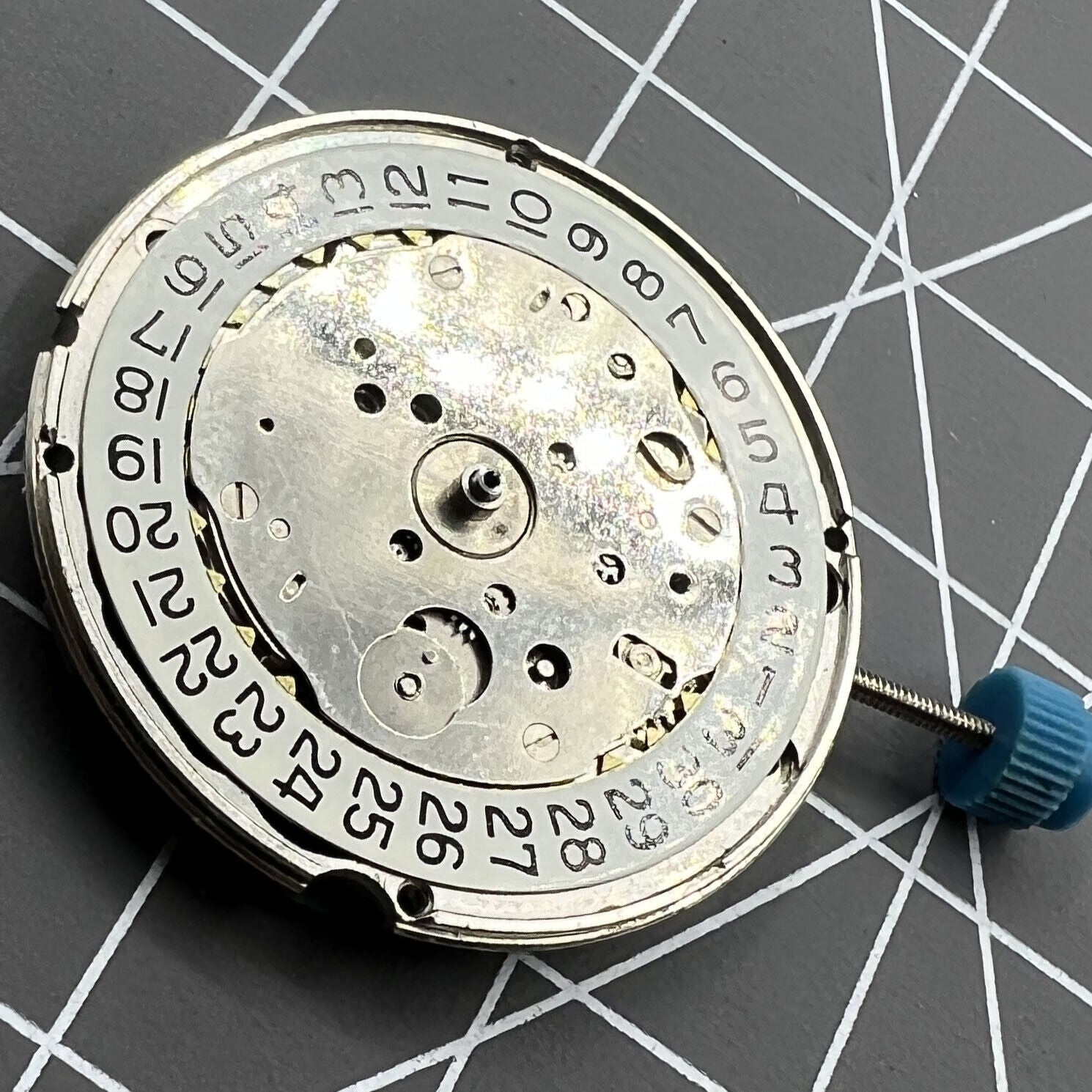 Swiss Made ETA 963.116 quartz watch movement with single calendar at 3 o'clock for precise timekeeping.