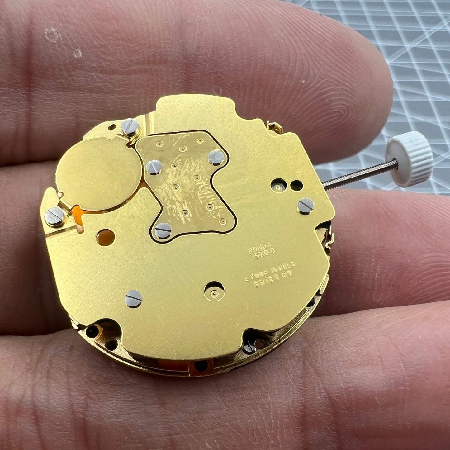 Ronda 3520D Swiss quartz movement watch mechanism for accurate accessory timing.