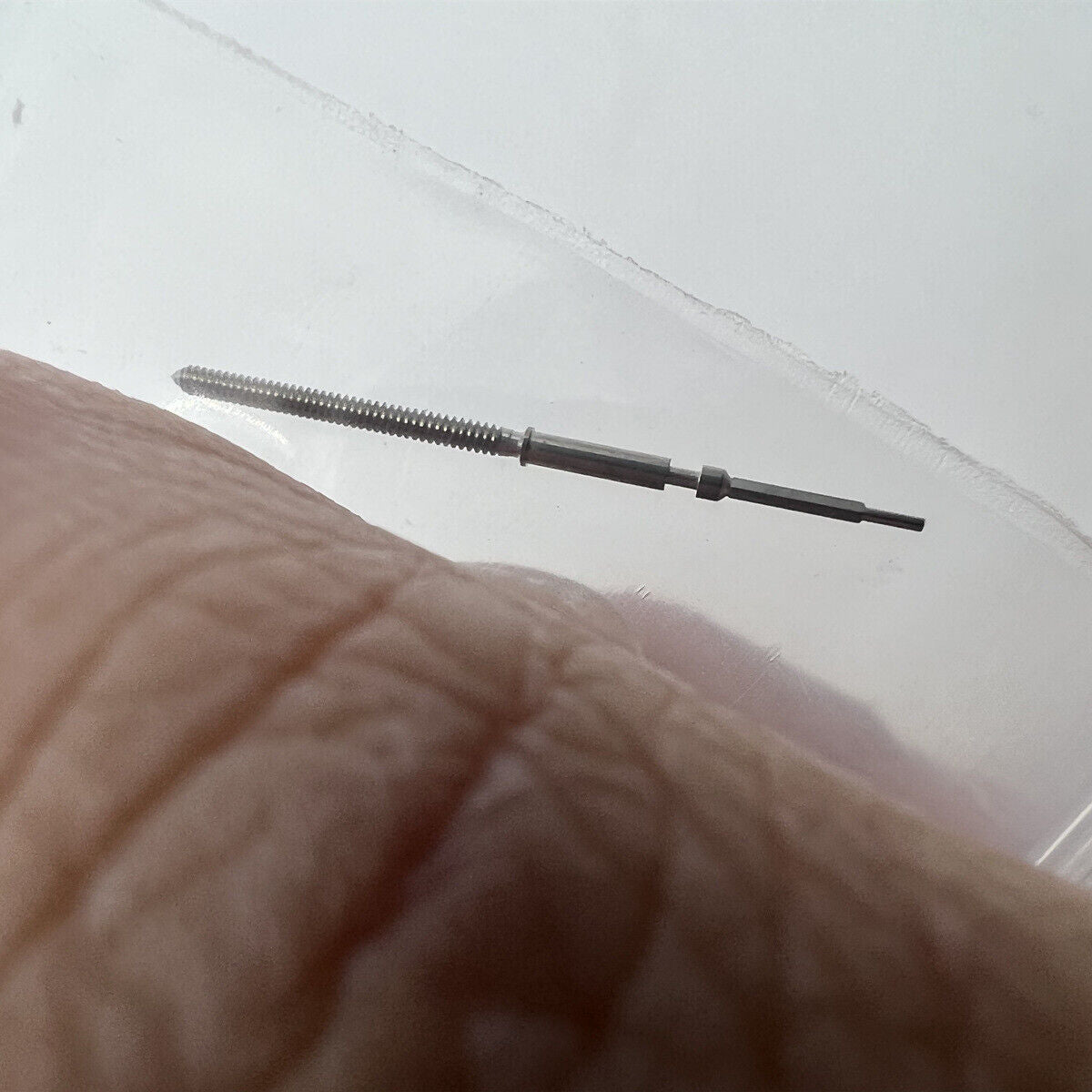 Swiss made watch winding stem for Ronda 7004 movement, compatible with 401# models, durable accessory.