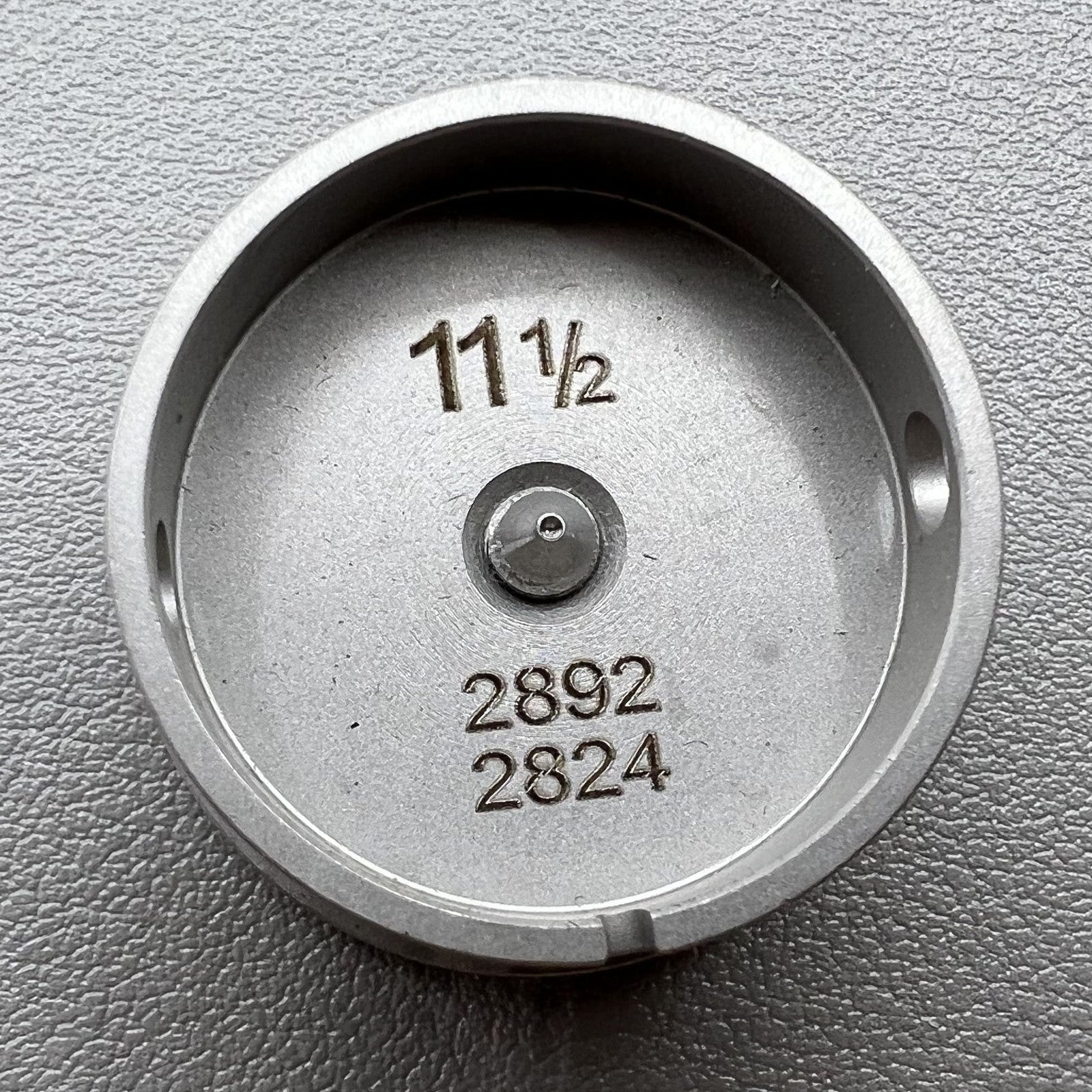 Size 11-1/2 Ligne Eta 2892/2824 movement holder with center screw for watch repair and assembly.