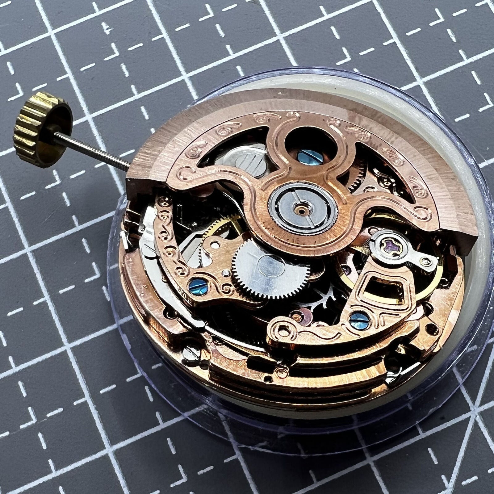 Rose gold hollow watch with mechanical movement, 4 eye subdials, and 7 hands for precise timekeeping.