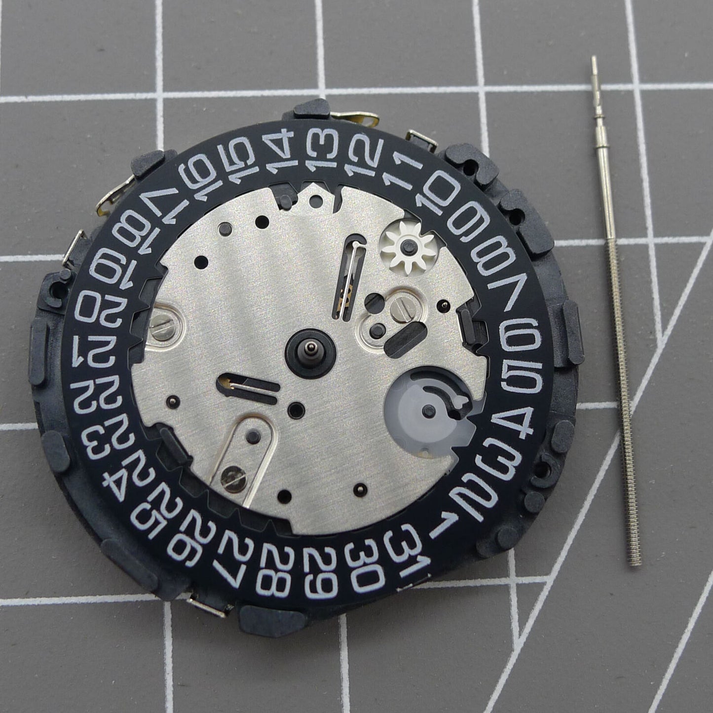 Japan Made VR32B quartz watch movement with multifunctional features and black dial for precision timekeeping.