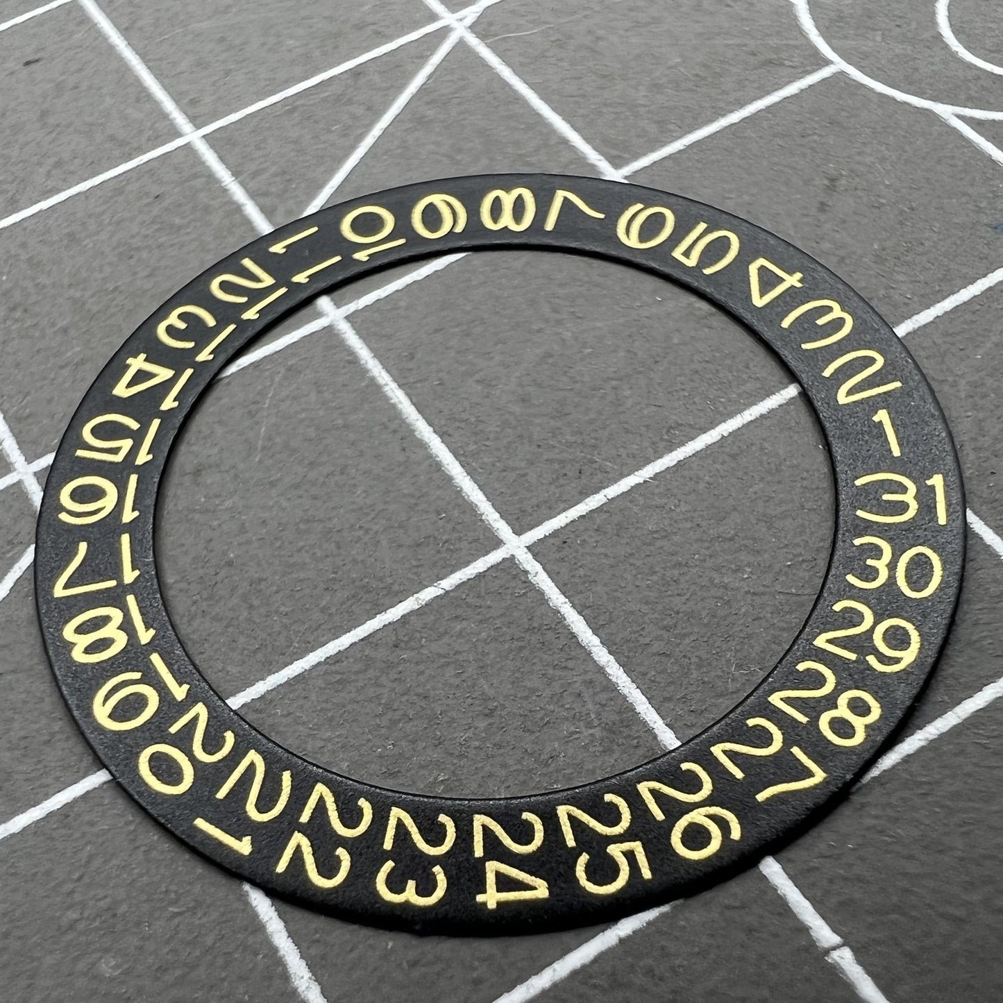 Golden date disk displaying characters on black background for Seiko NH35 NH36 movements