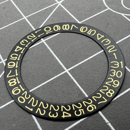 Golden date disk displaying characters on black background for Seiko NH35 NH36 movements