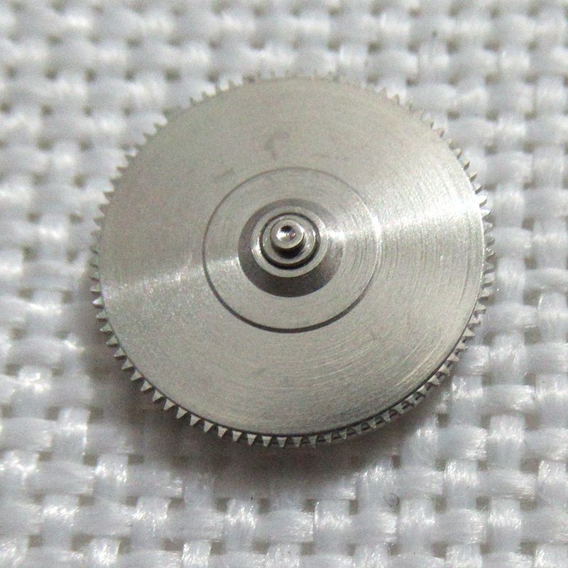Complete barrel with new mainspring for YN55 YN56 watch movement. Durable replacement part for precise function.