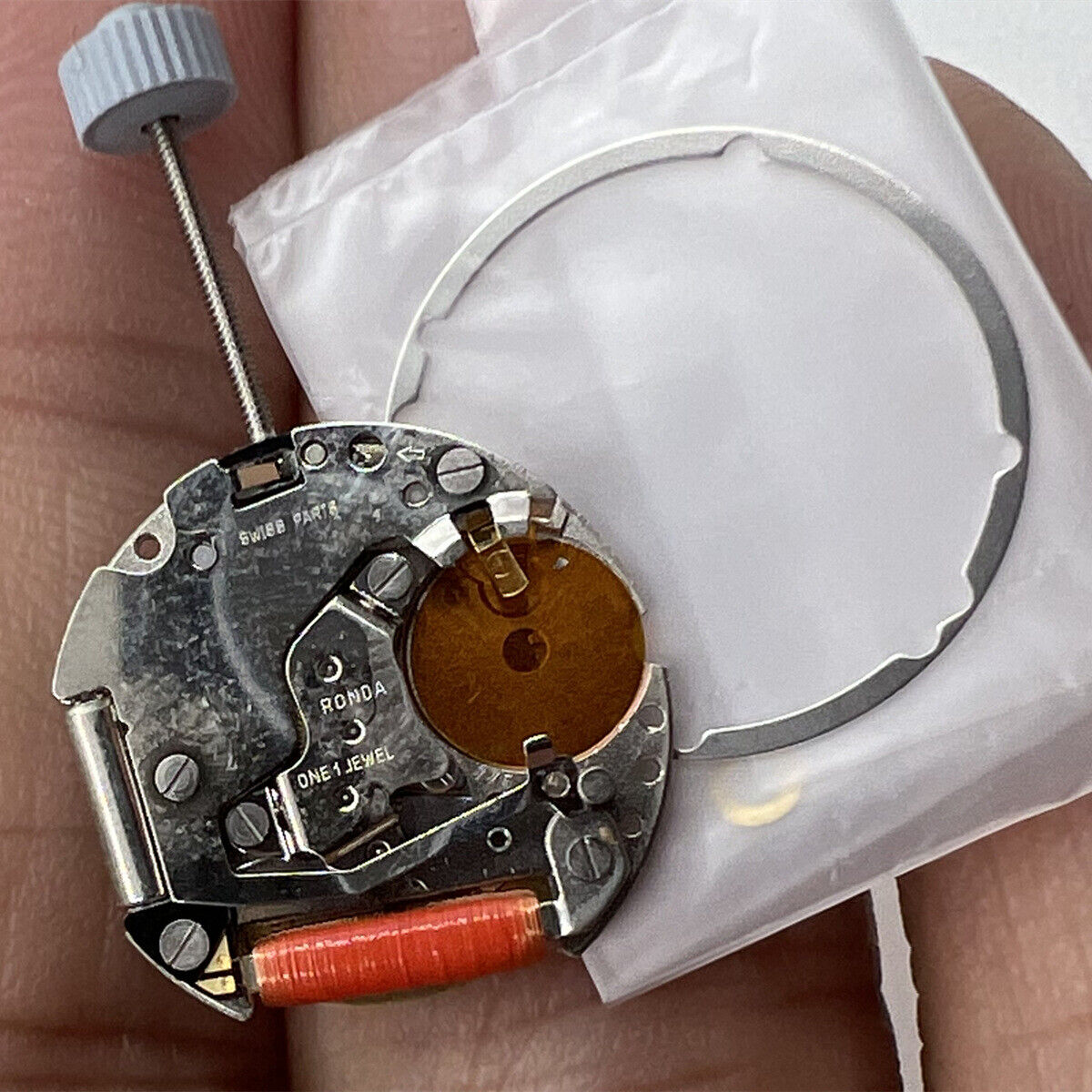 Ronda 775 Swiss quartz watch movement with date display at 3 o'clock, precise timekeeping component.