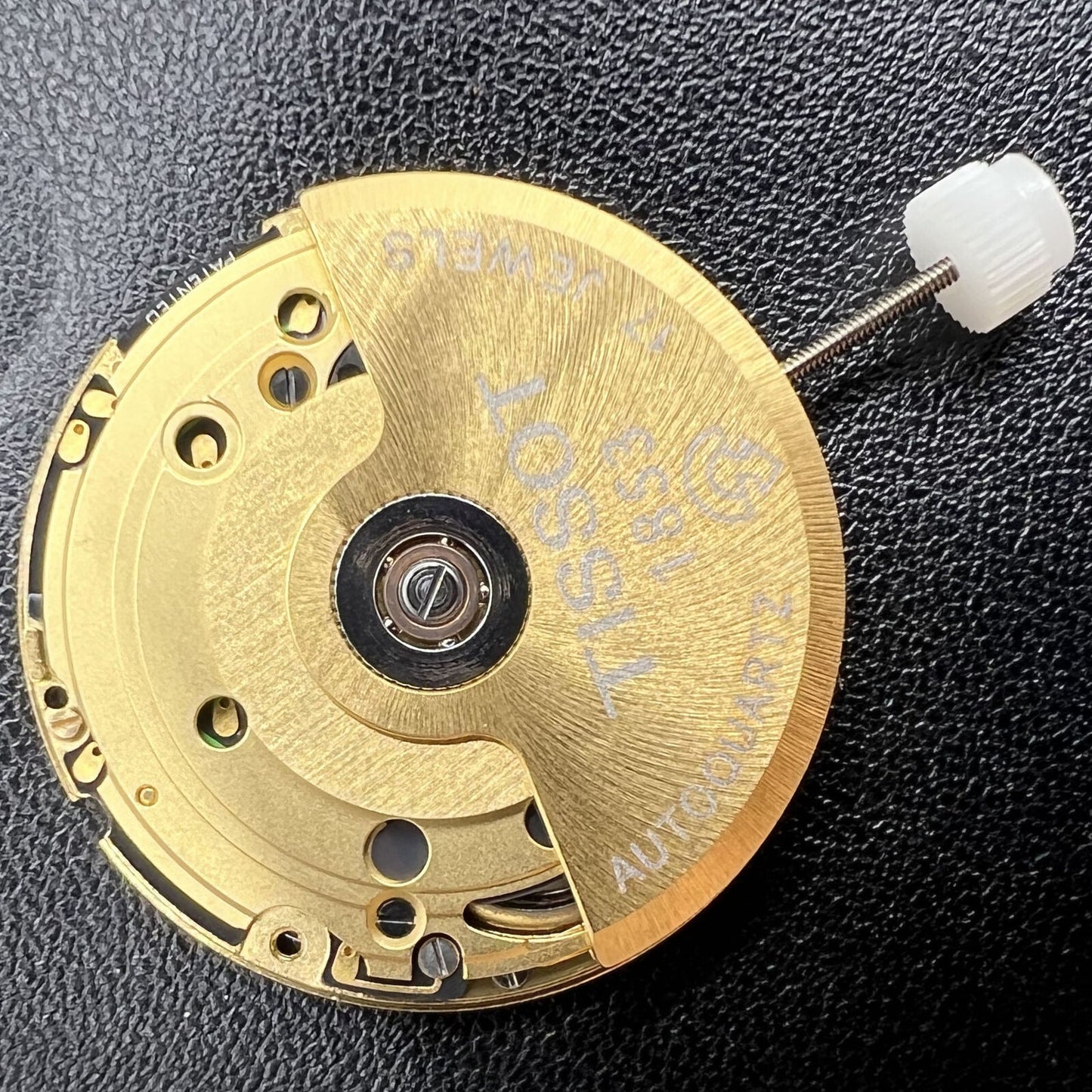 Golden Swiss Made ETA205.911 watch movement by ETA, precise kinetic energy mechanism for premium accessories.