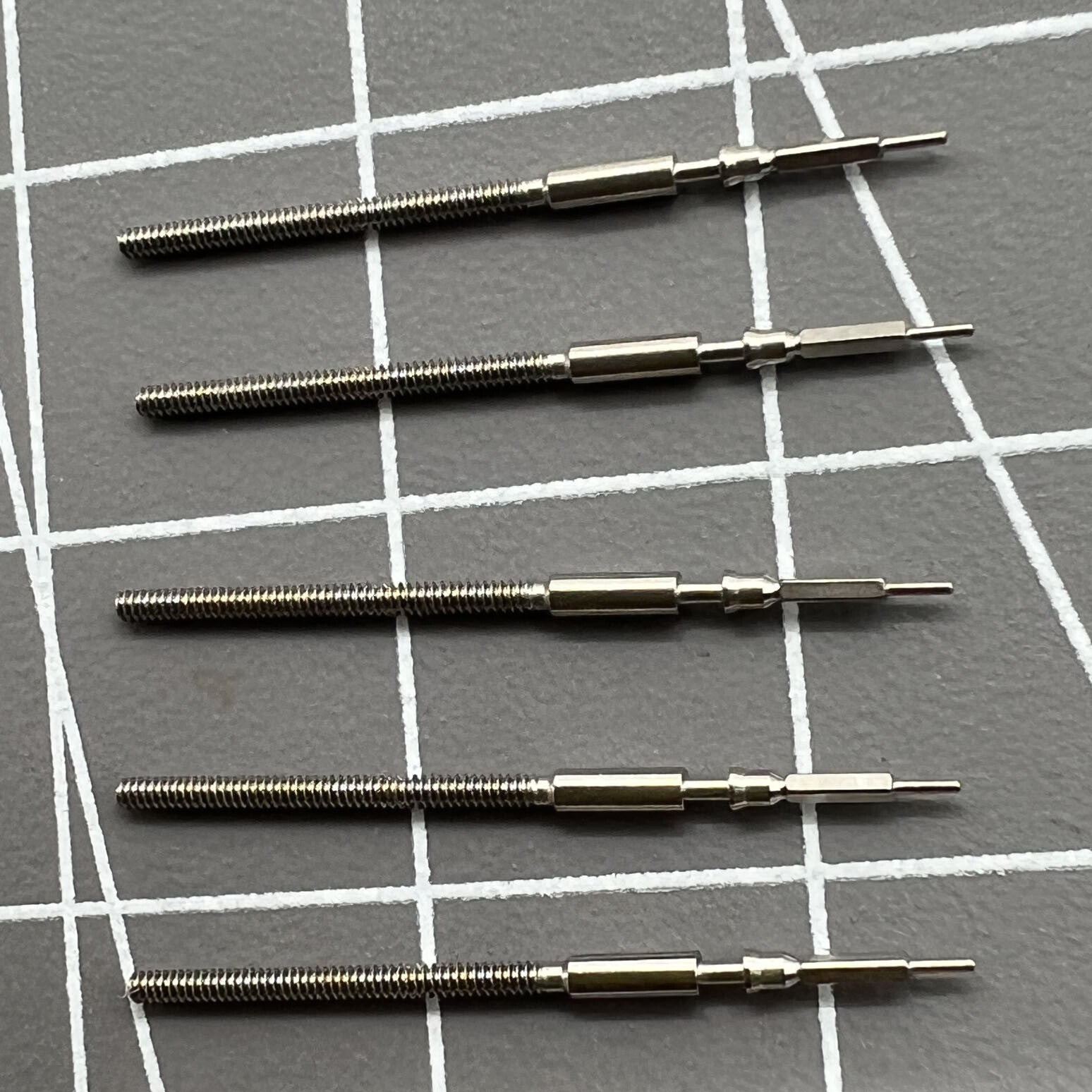 Set of 5 watch winding stems for Miyota 9015 movement, compatible with multiple watch models.