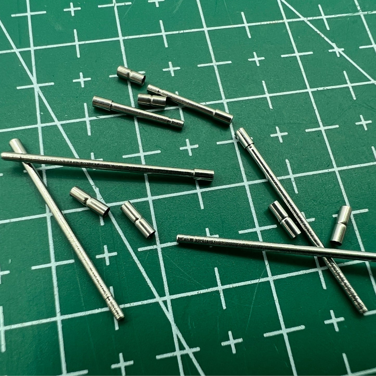 AB-638NTWP stainless steel notched watch band tube with pins for secure watch accessory attachment.