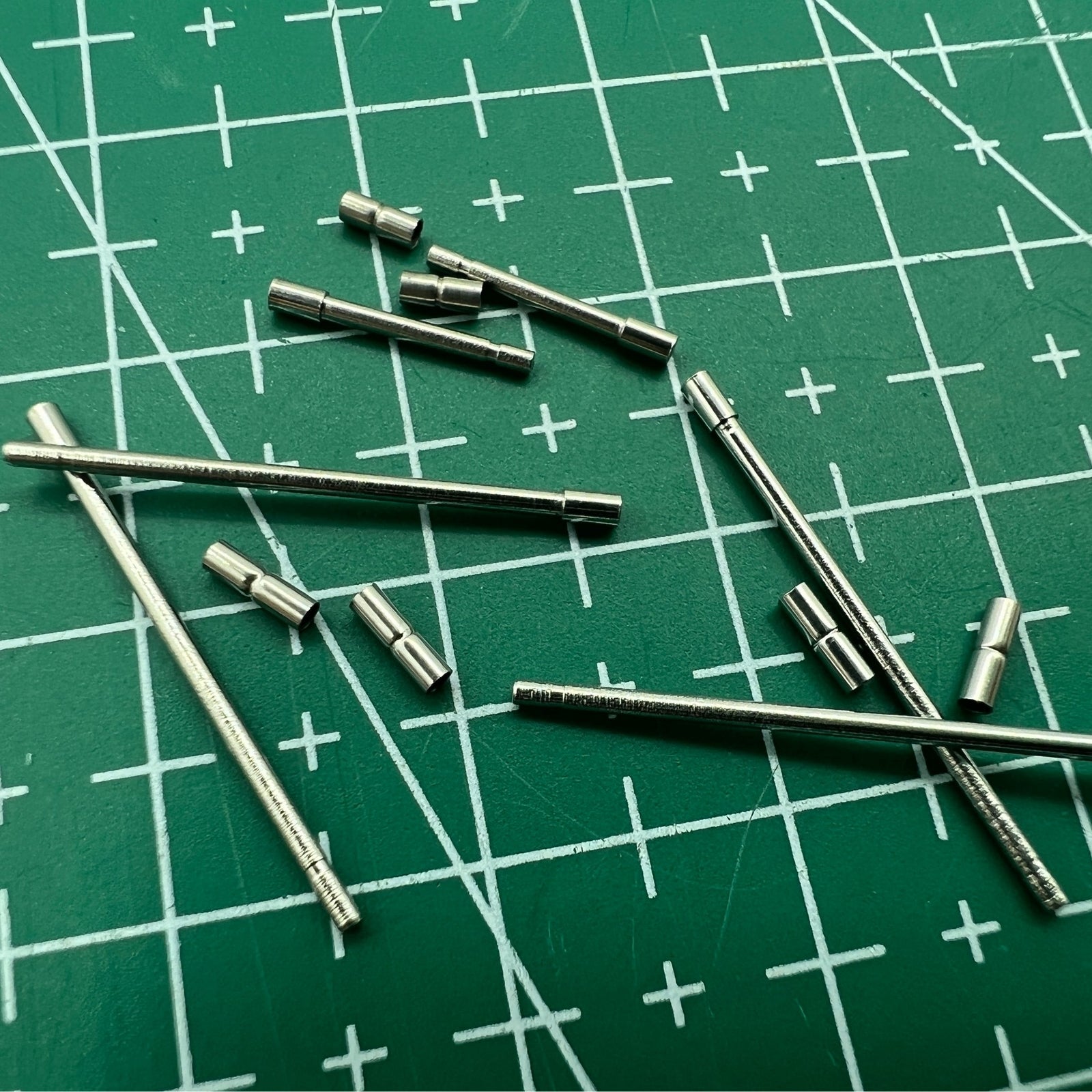 AB-638NTWP stainless steel notched watch band tube with pins for secure watch accessory attachment.
