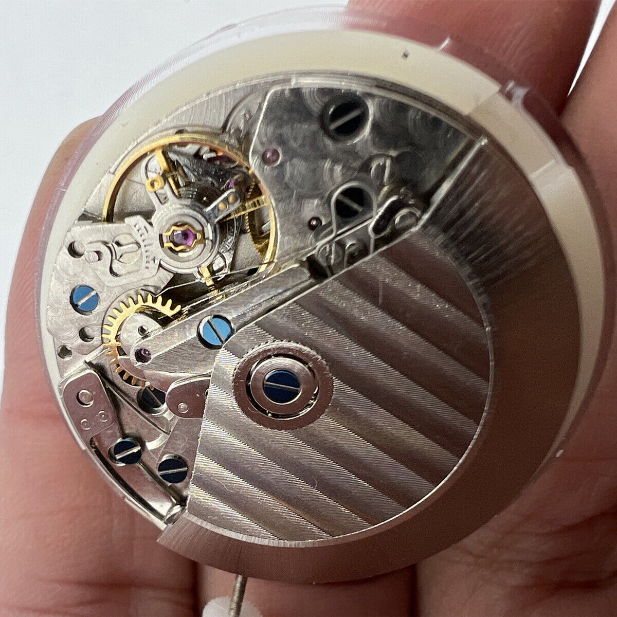 Asian 7750 automatic chronograph movement with white 4:30 calendar and seconds subdial at 9, precise watch parts.
