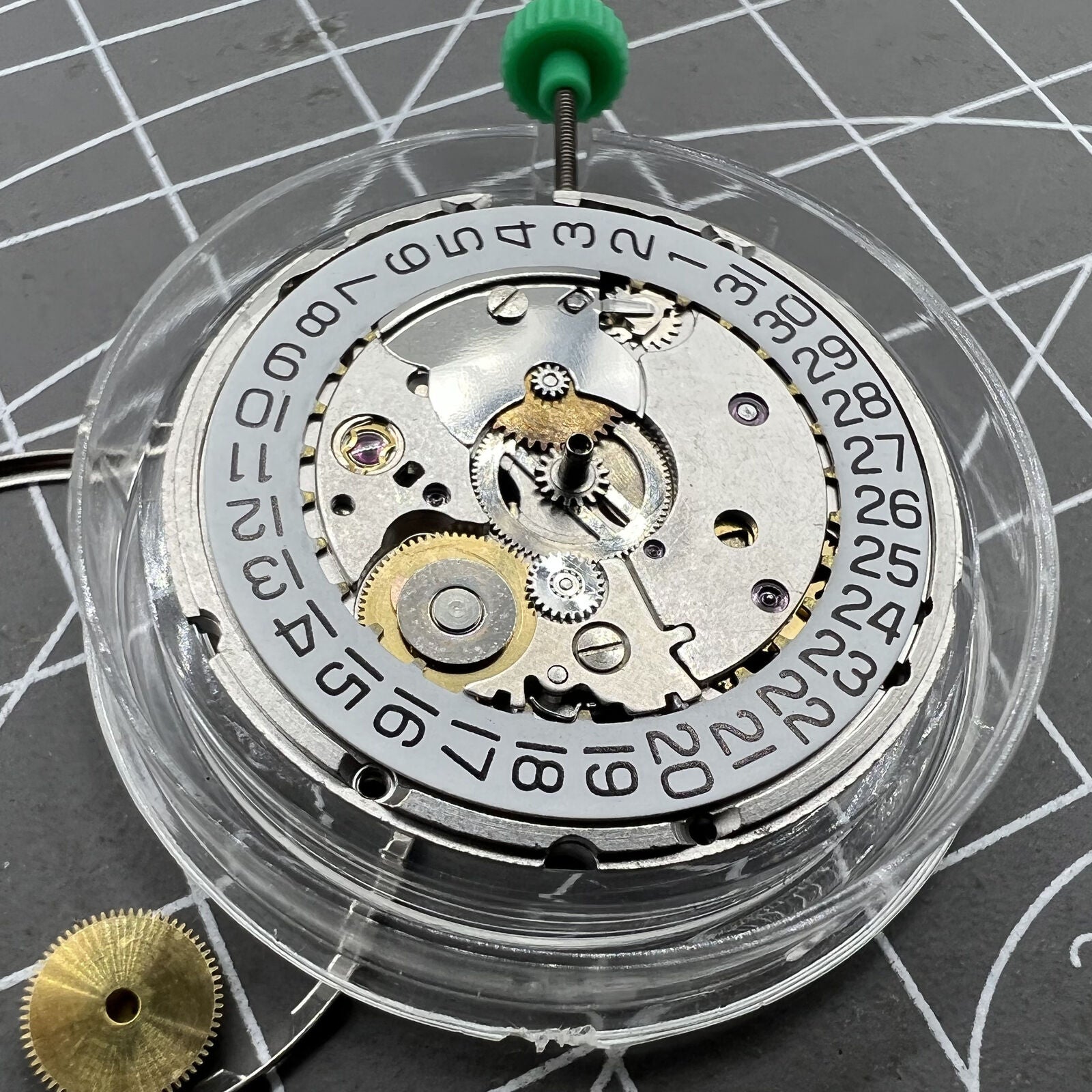 ETA 2824-2 Swiss mechanical movement close-up showing intricate watch mechanism details.