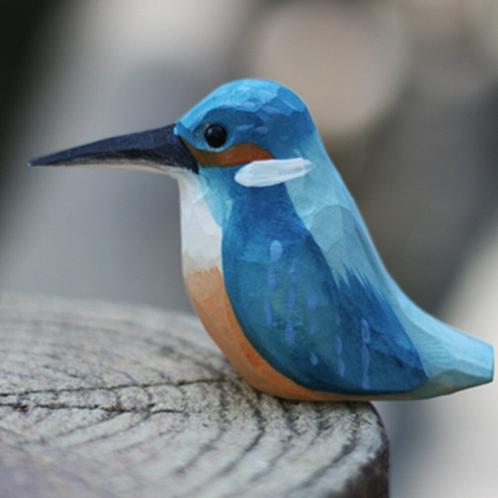 Handmade blue bird wooden figurine, detailed collectible art for elegant home decor.