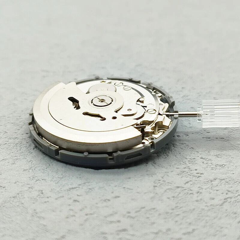 Seiko Japan Made NH36 automatic watch movement with date dial and angled crown at 3:48 position.