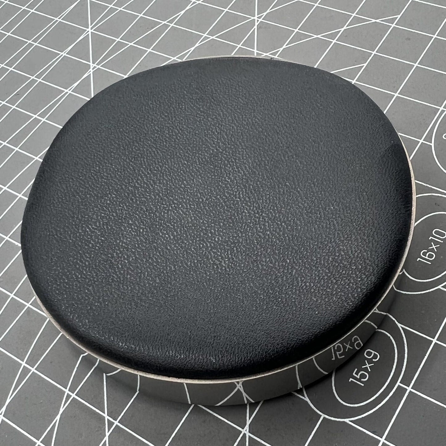 Large leather watch movement cushion pad, perfect for secure watch repairs and display.