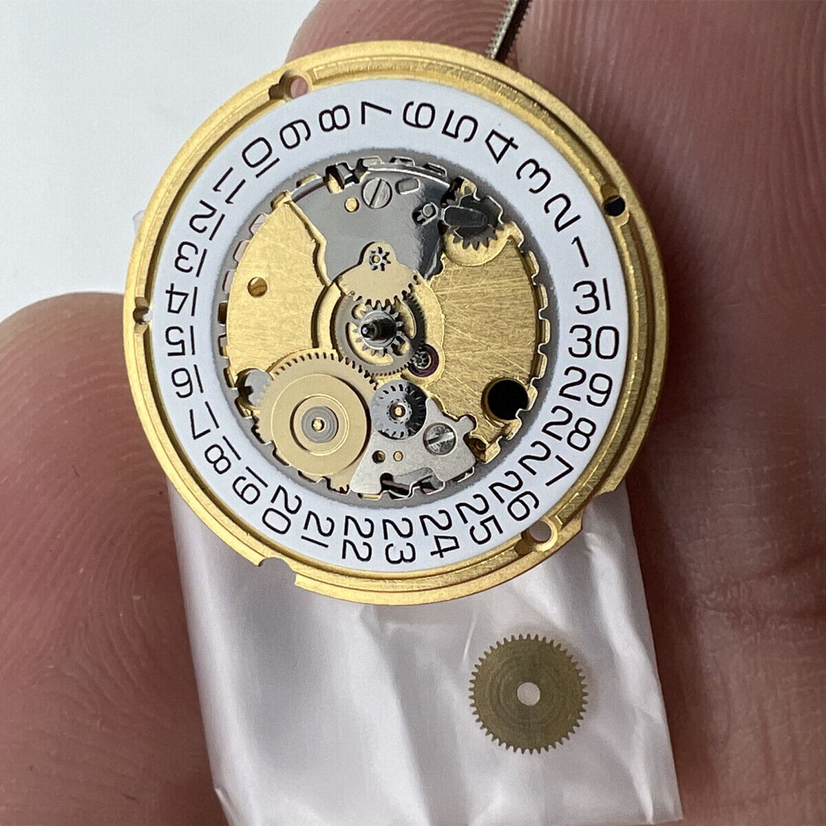 ETA 956.412 Swiss Made quartz watch movement showing three hands and date window at 3 o'clock position.